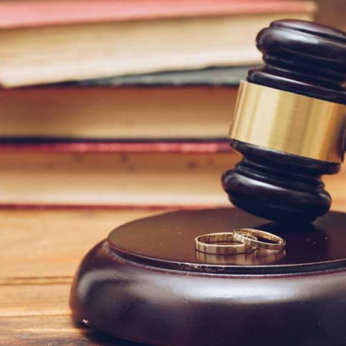 wooden-judge-gavel-and-golden-rings-divorce-PYVEJKP