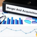 File folder with Merger and Acquisition and financial graphs.