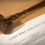 last will and testament form with gavel, shallow dof