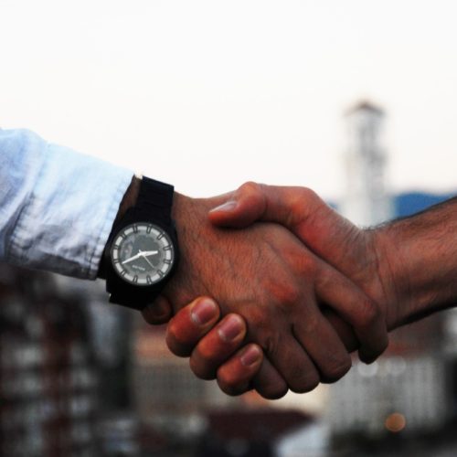 handshake-business-hand Real Estate